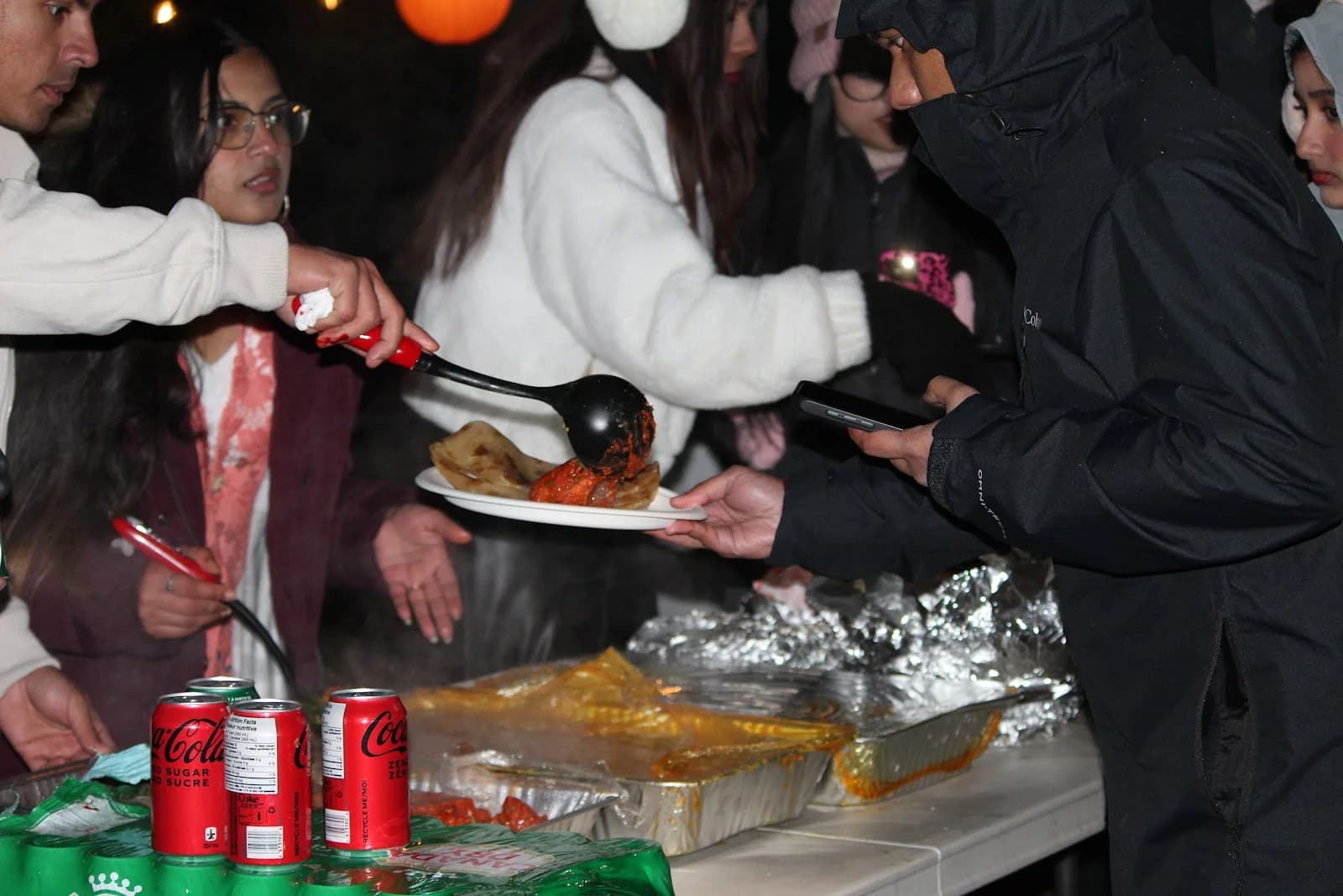 BSS attendees serving food at a shared outdoor meal